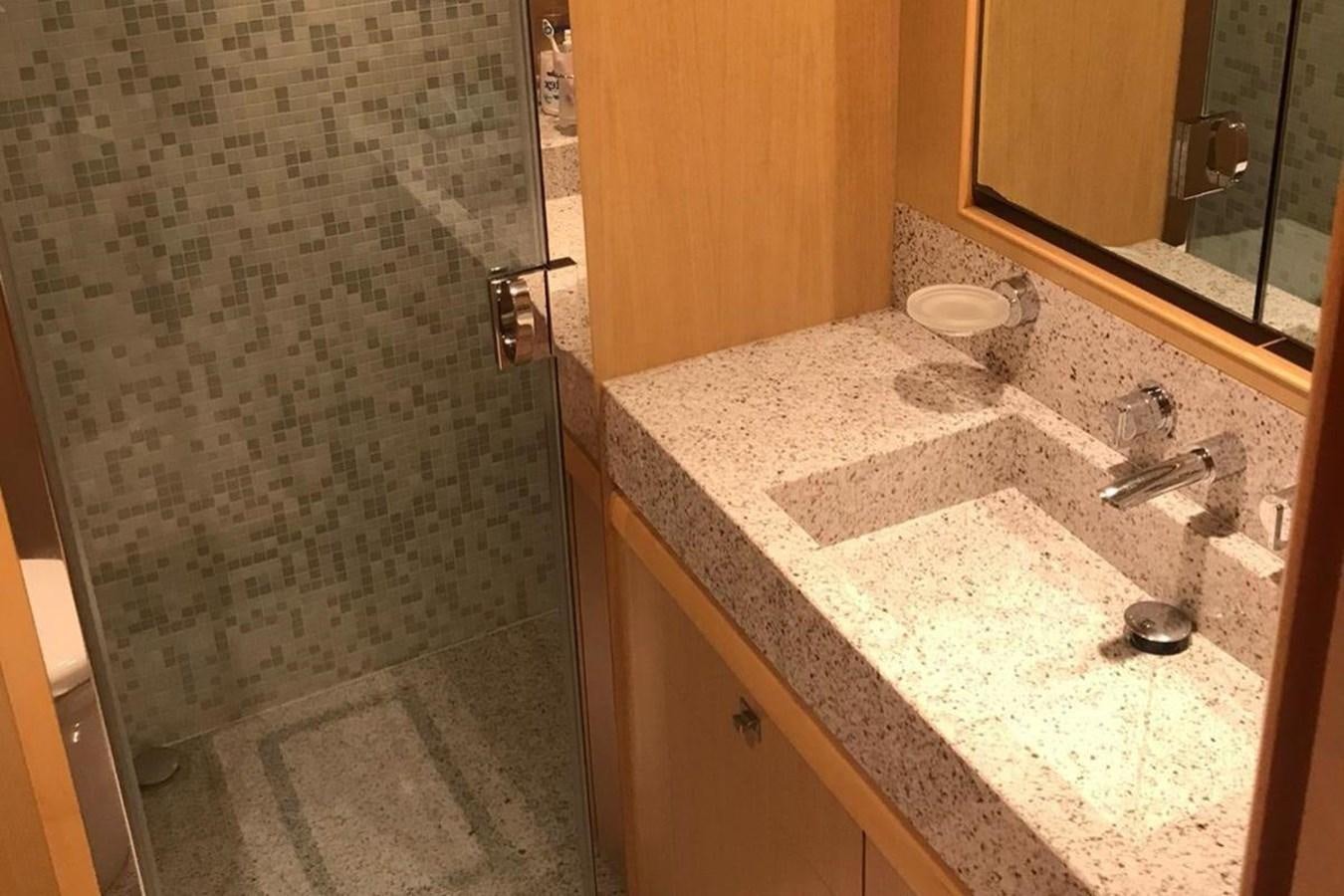 a bathroom with a marble counter top aboard PRINCESS I Yacht for Sale