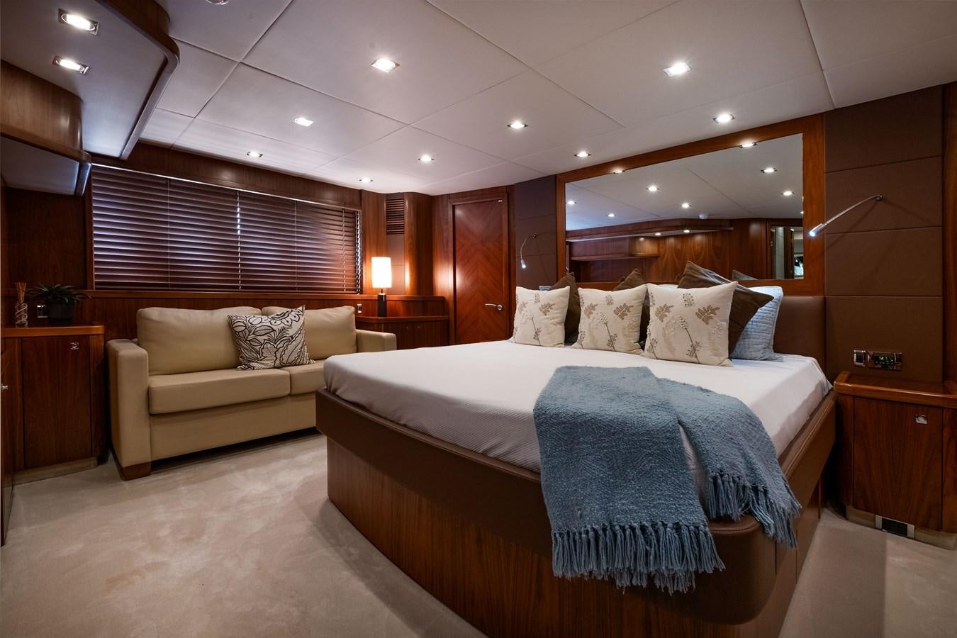 a hotel room with a bed and a couch aboard EL TIO Yacht for Sale