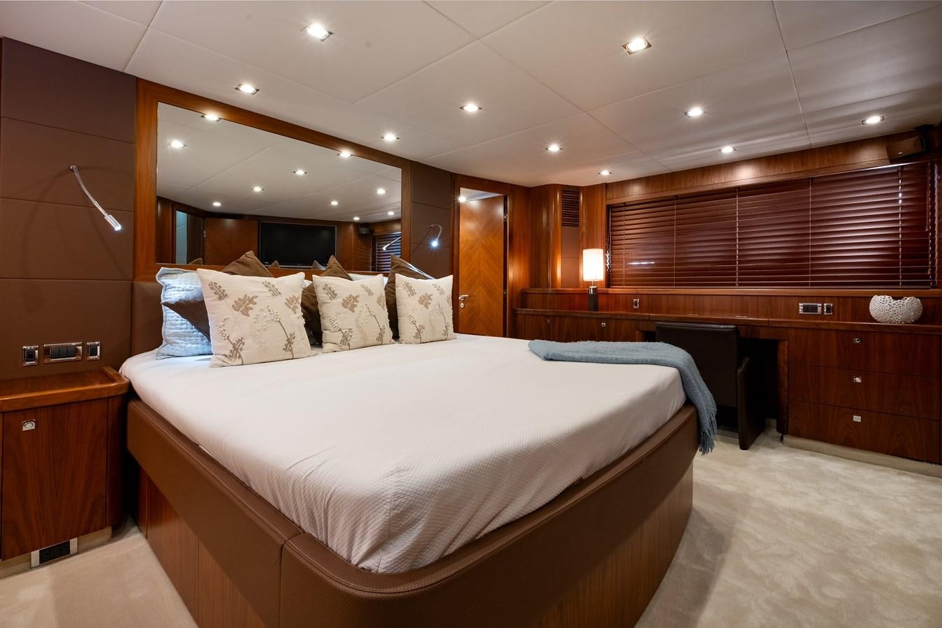 a large bed in a room aboard EL TIO Yacht for Sale