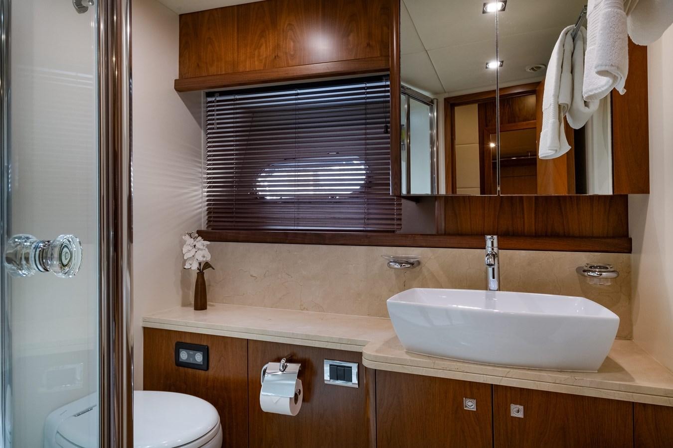 a bathroom with a sink and toilet aboard EL TIO Yacht for Sale