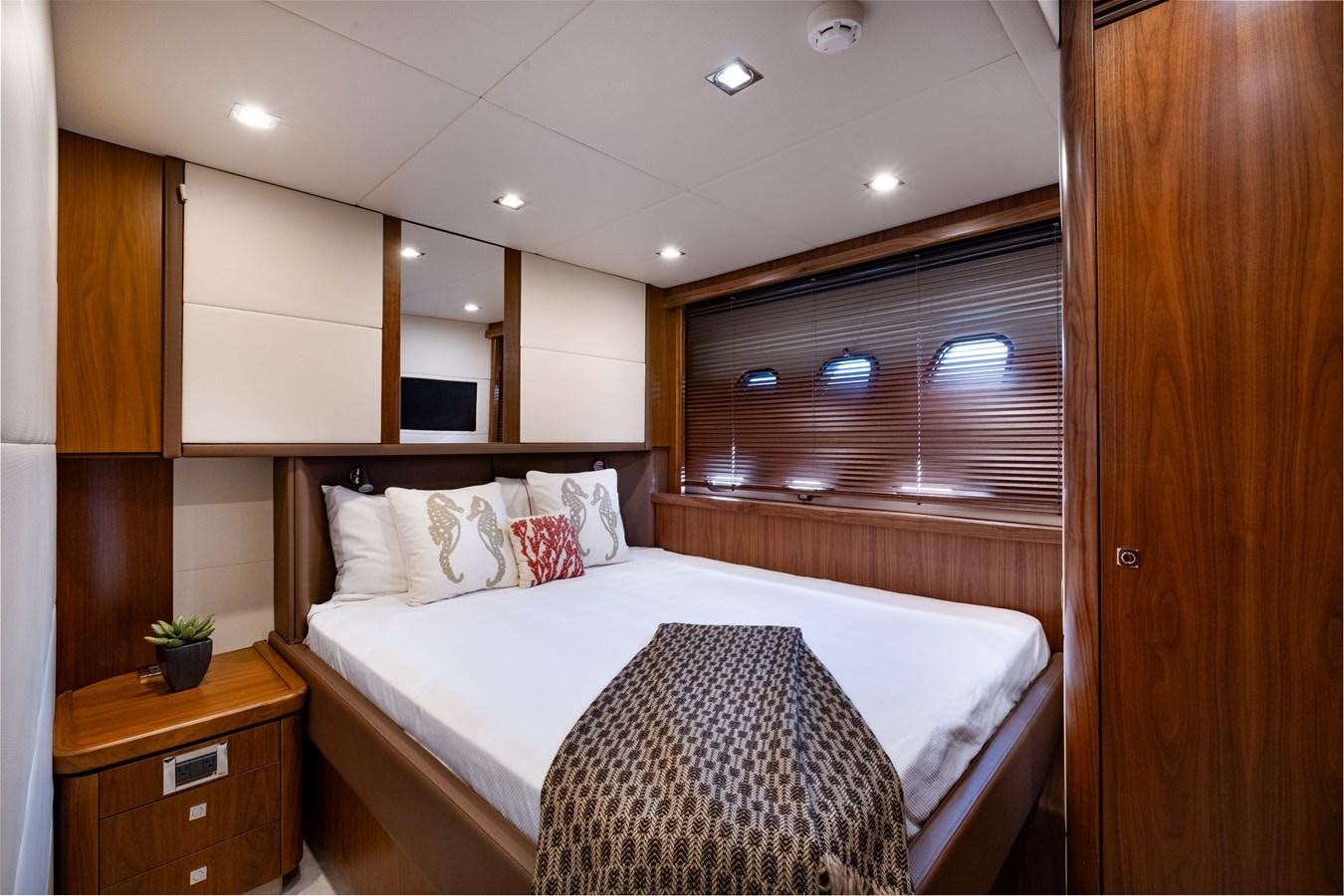a bed in a room aboard EL TIO Yacht for Sale
