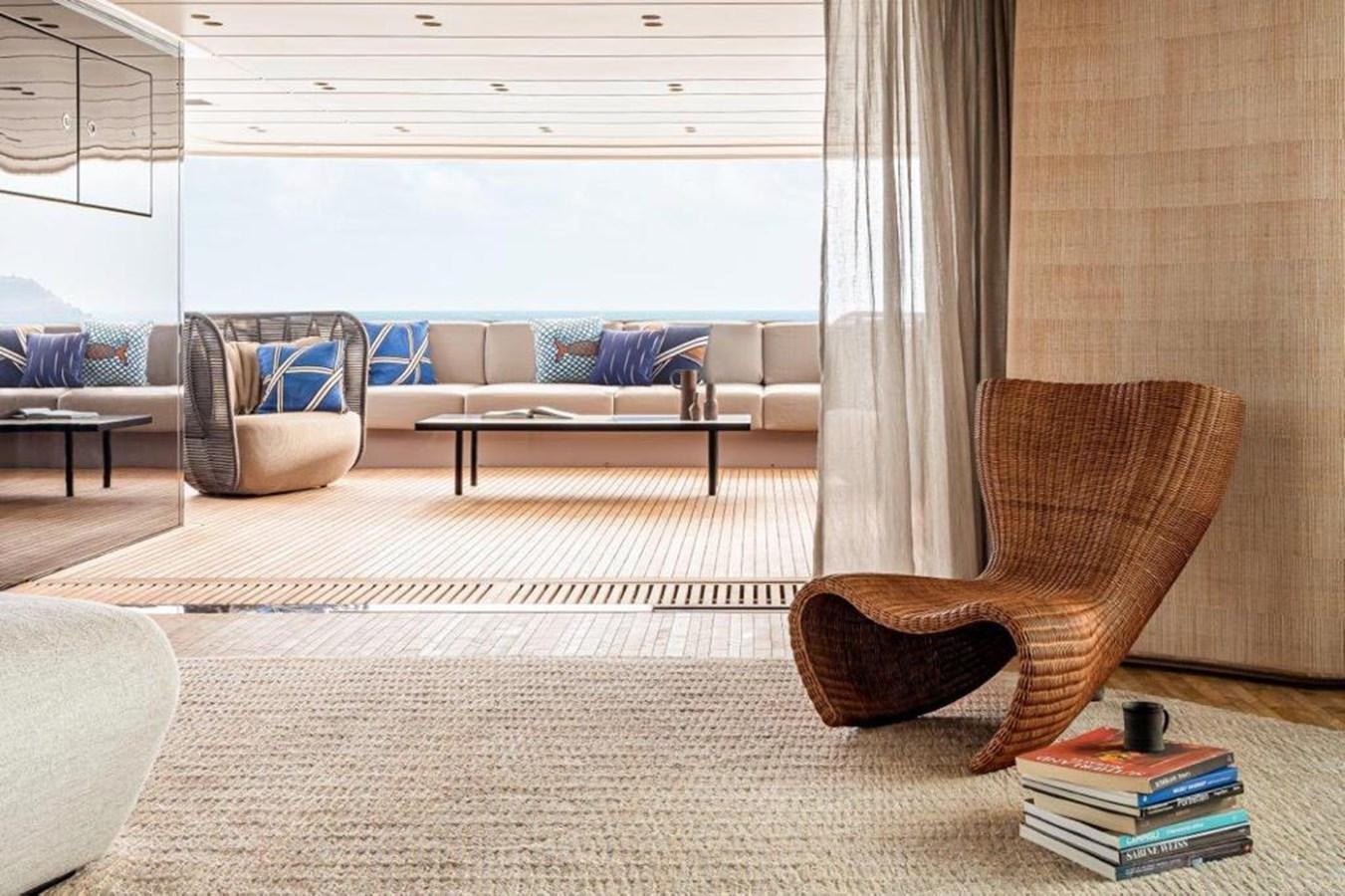 a room with a couch and a chair and a table aboard SANLORENZO SD118 #101 Yacht for Sale