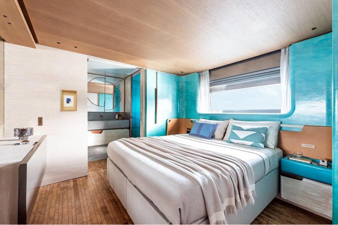 a bedroom with a bed and a desk aboard SANLORENZO SD118 #101 Yacht for Sale