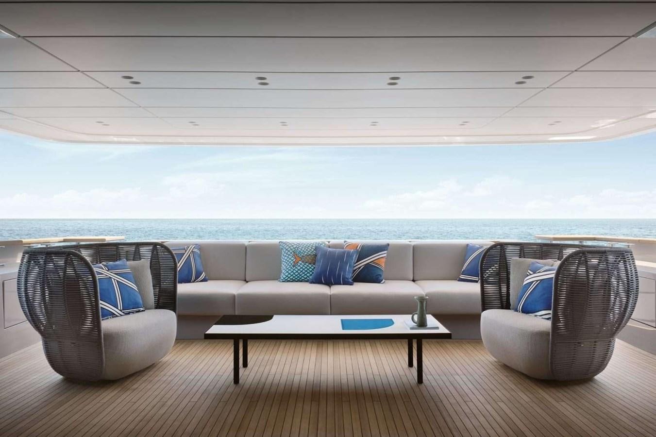a couch and a table in front of a window aboard SANLORENZO SD118 #101 Yacht for Sale