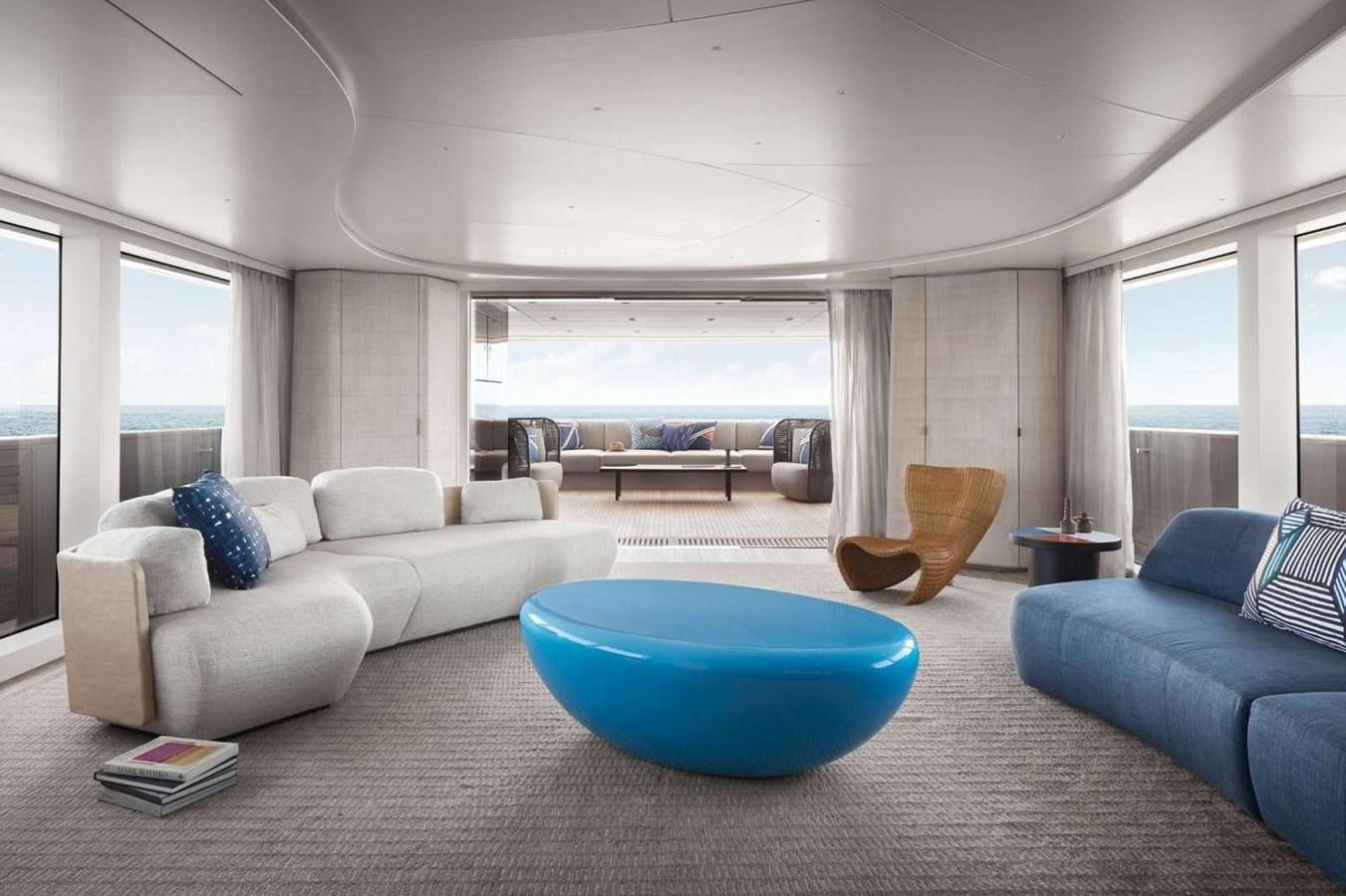 a living room with a blue couch aboard SANLORENZO SD118 #101 Yacht for Sale