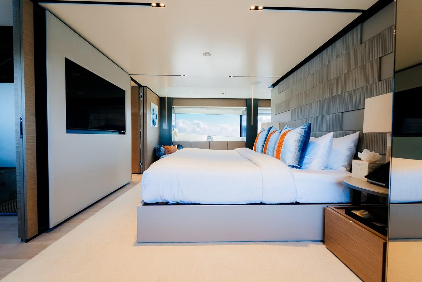 a bedroom with a large bed aboard COFINA Yacht for Sale