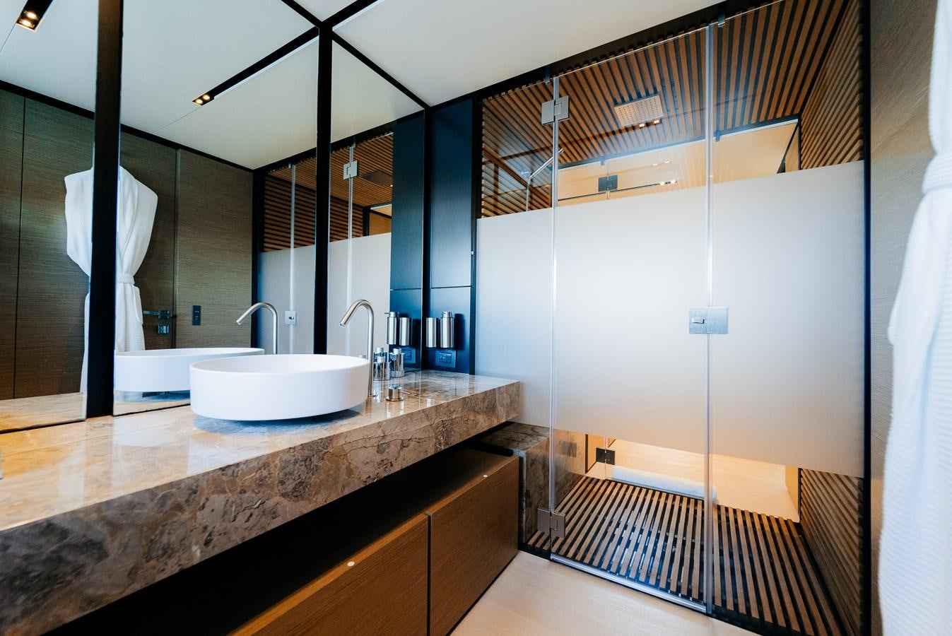 a bathroom with a sink and a mirror aboard COFINA Yacht for Sale