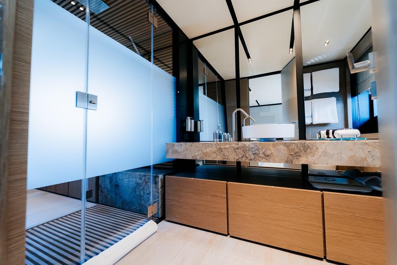 a kitchen with a large glass shower aboard COFINA Yacht for Sale