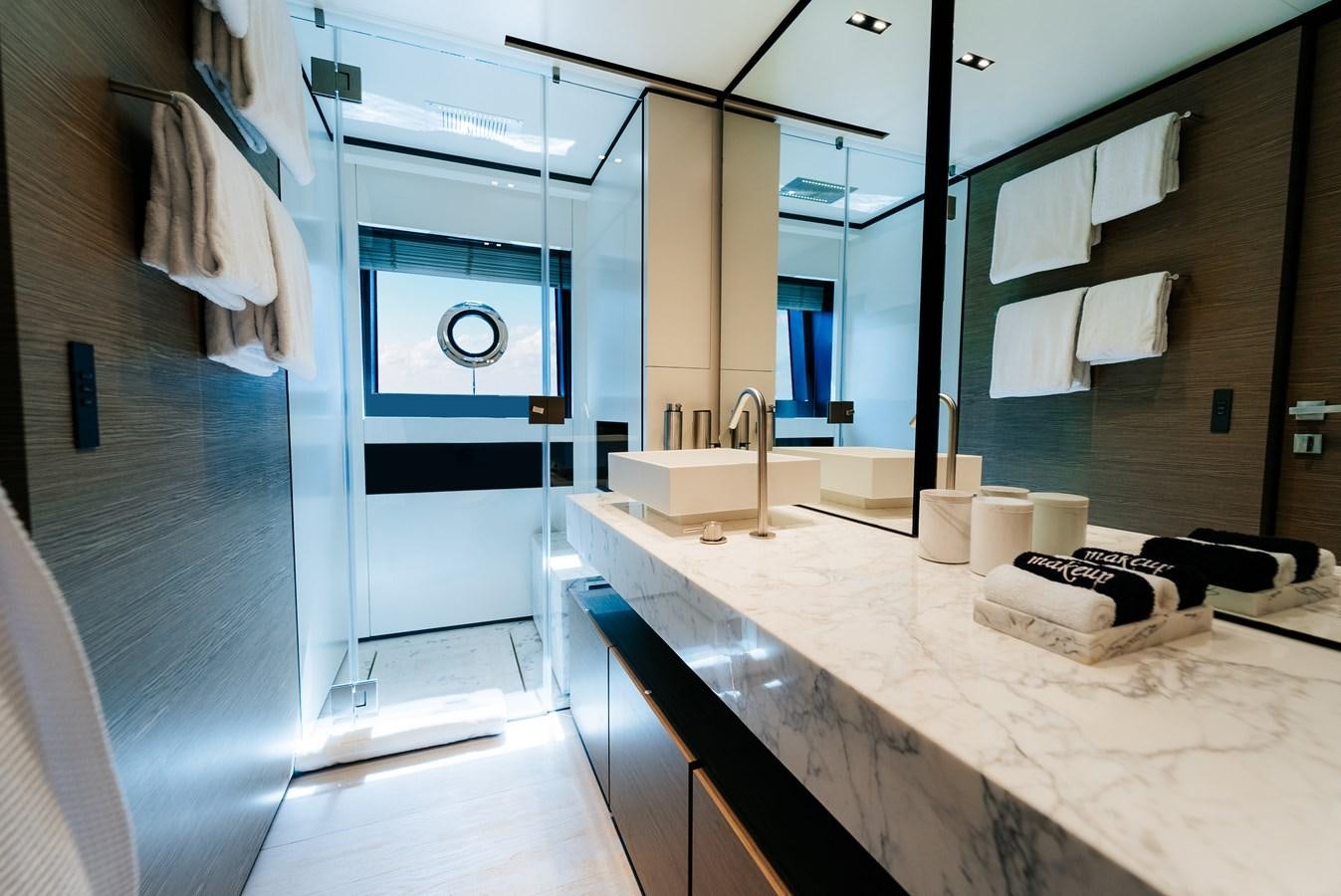 a bathroom with a countertop sink and a mirror aboard COFINA Yacht for Sale