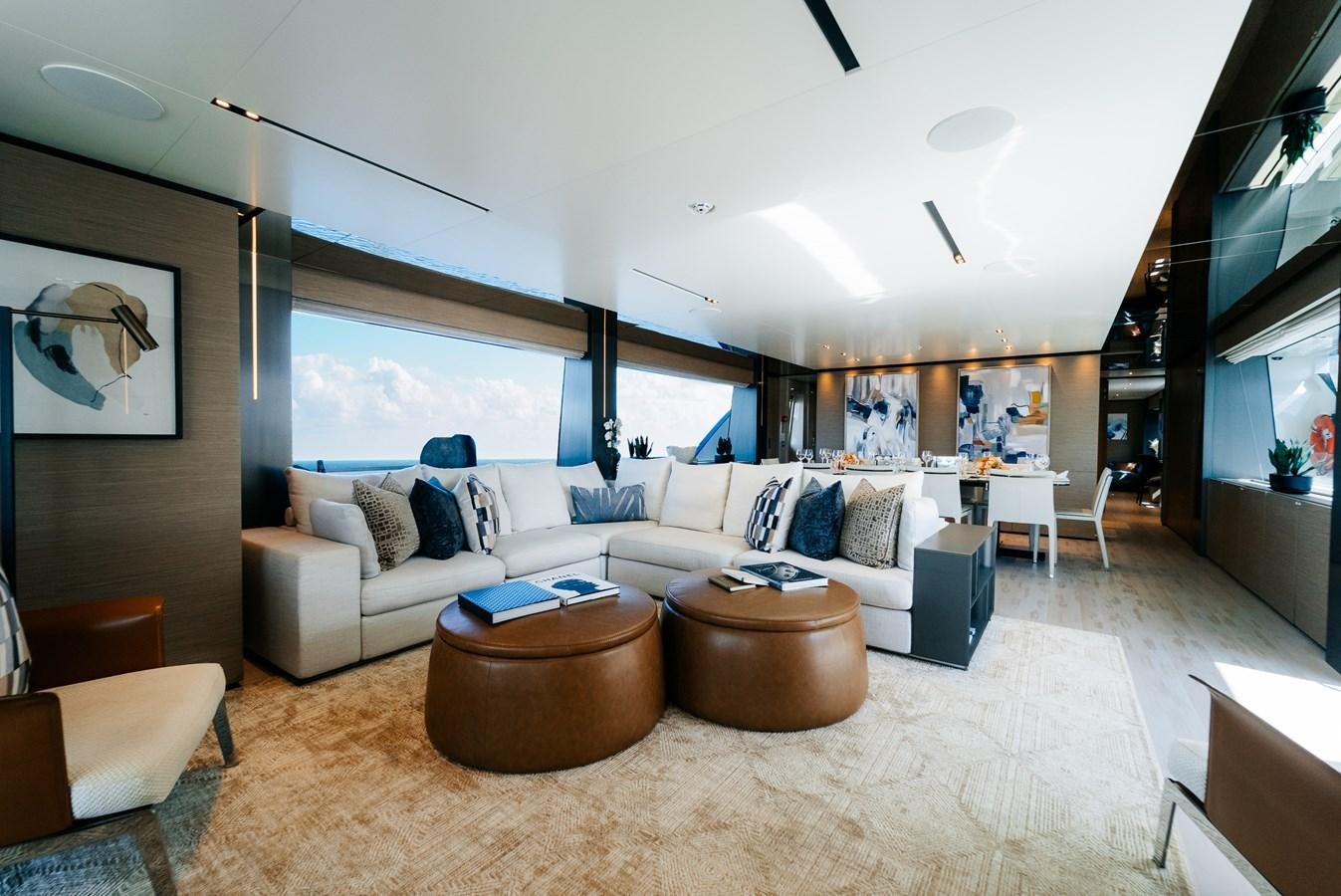 a living room with a large window aboard COFINA Yacht for Sale