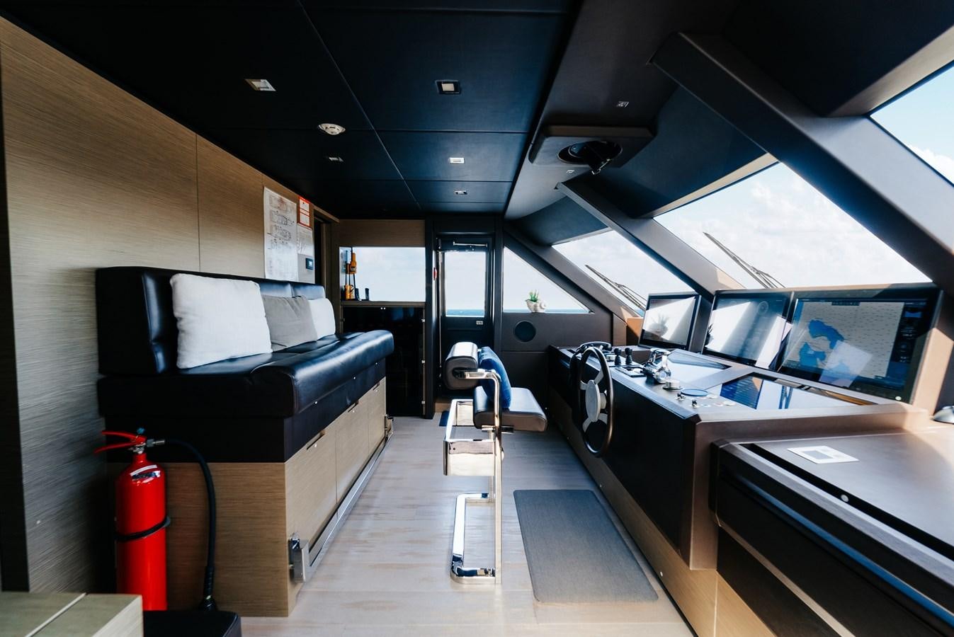 inside of a vehicle with a desk and a chair aboard COFINA Yacht for Sale