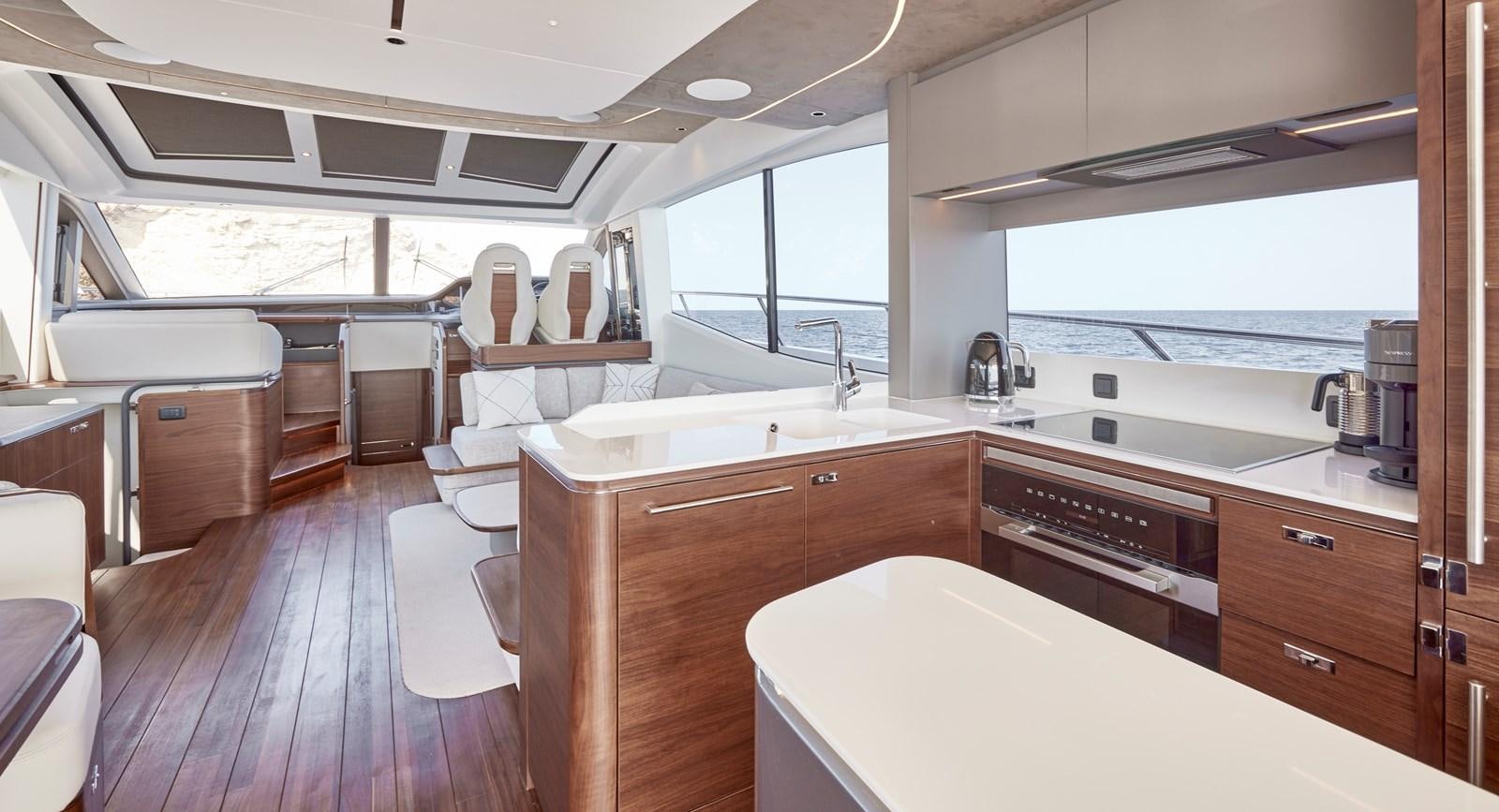 a kitchen with a large window aboard VENTURE Yacht for Sale
