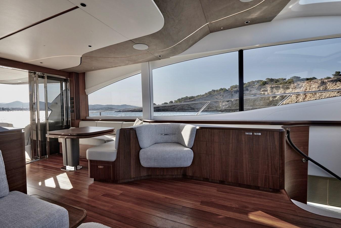 a room with a table and chairs aboard VENTURE Yacht for Sale