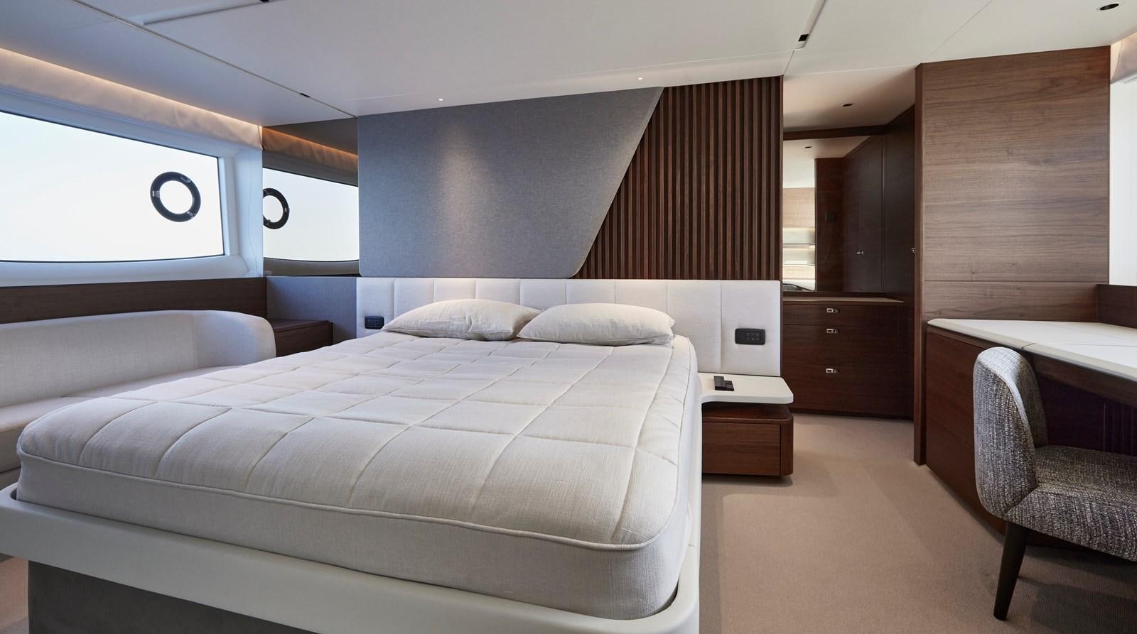 a room with a bed and a desk aboard VENTURE Yacht for Sale