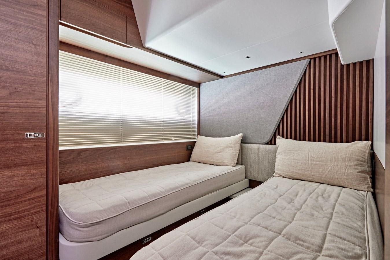 a couple of beds in a room aboard VENTURE Yacht for Sale