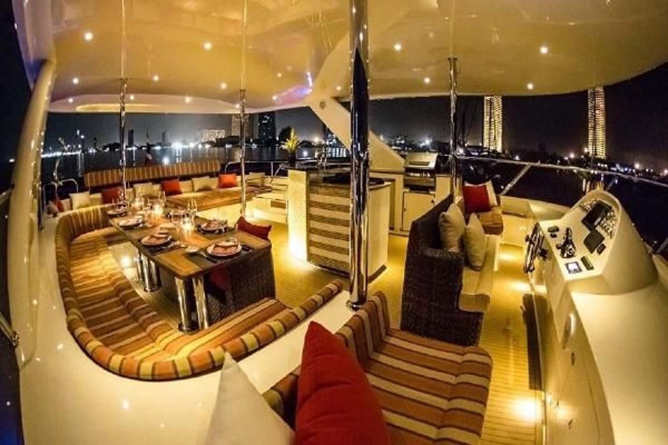 a room with a table and chairs aboard 2021 HELIOTROPE NL 70 SOLAR ELECTRIC Yacht for Sale
