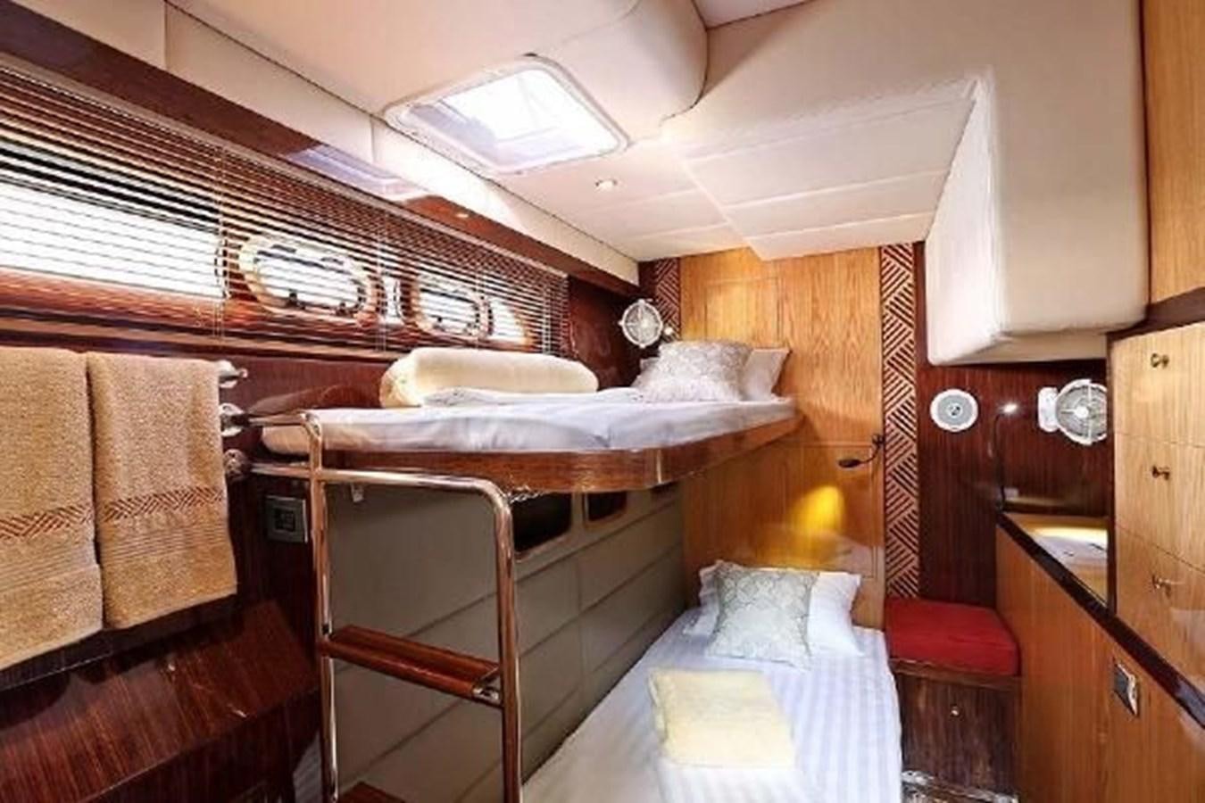 a room with bunk beds aboard 2021 HELIOTROPE NL 70 SOLAR ELECTRIC Yacht for Sale