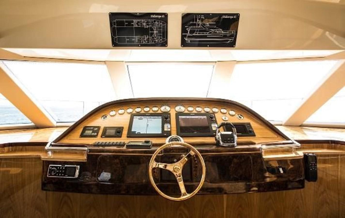 a brown and black radio aboard 2021 HELIOTROPE NL 70 SOLAR ELECTRIC Yacht for Sale