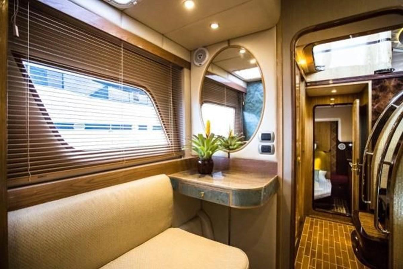 a room with a table and a window aboard 2021 HELIOTROPE NL 70 SOLAR ELECTRIC Yacht for Sale