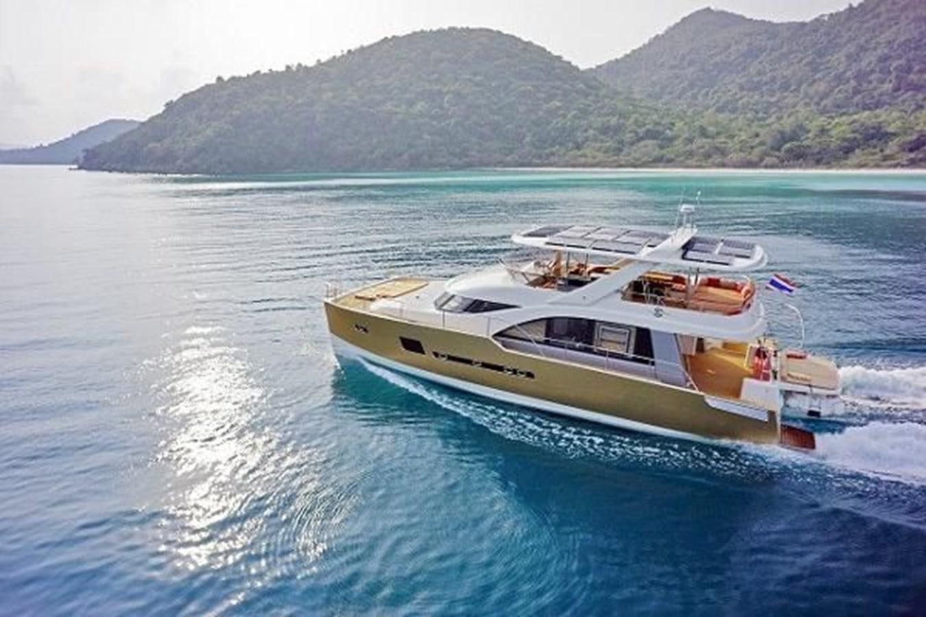a boat on the water aboard 2021 HELIOTROPE NL 70 SOLAR ELECTRIC Yacht for Sale