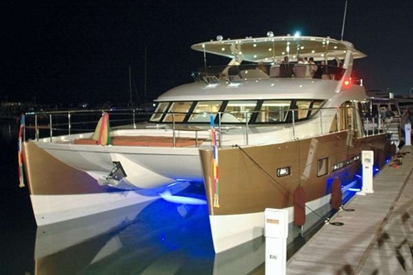 a boat on a dock aboard 2021 HELIOTROPE NL 70 SOLAR ELECTRIC Yacht for Sale