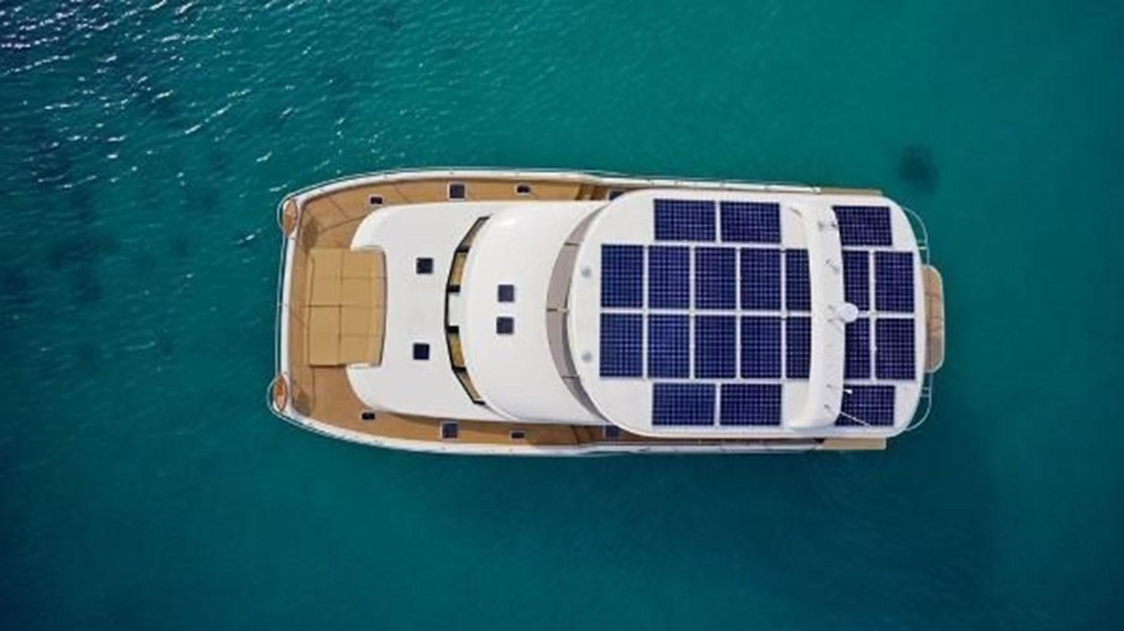 a white and black object on a blue surface aboard 2021 HELIOTROPE NL 70 SOLAR ELECTRIC Yacht for Sale