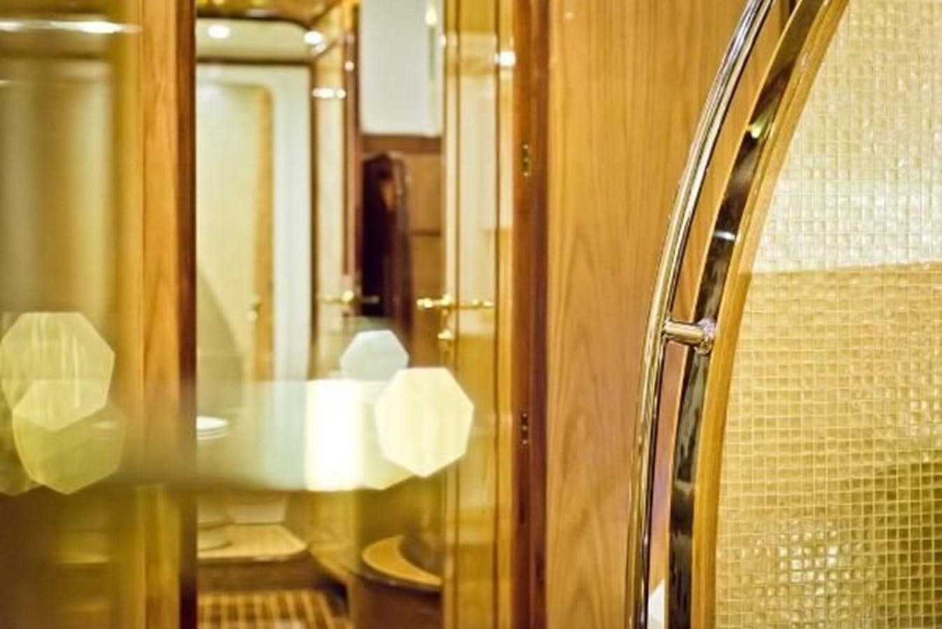 a bathroom with a mirror aboard 2021 HELIOTROPE NL 70 SOLAR ELECTRIC Yacht for Sale