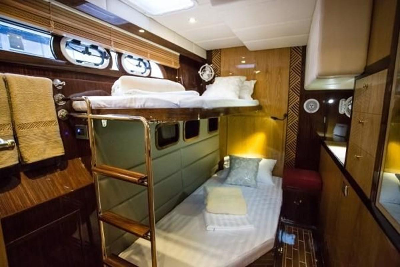 a room with bunk beds aboard 2021 HELIOTROPE NL 70 SOLAR ELECTRIC Yacht for Sale