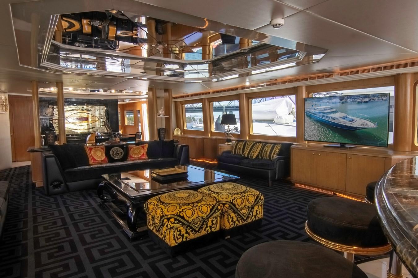 a living room with a large fireplace aboard LADY AUDREY Yacht for Sale
