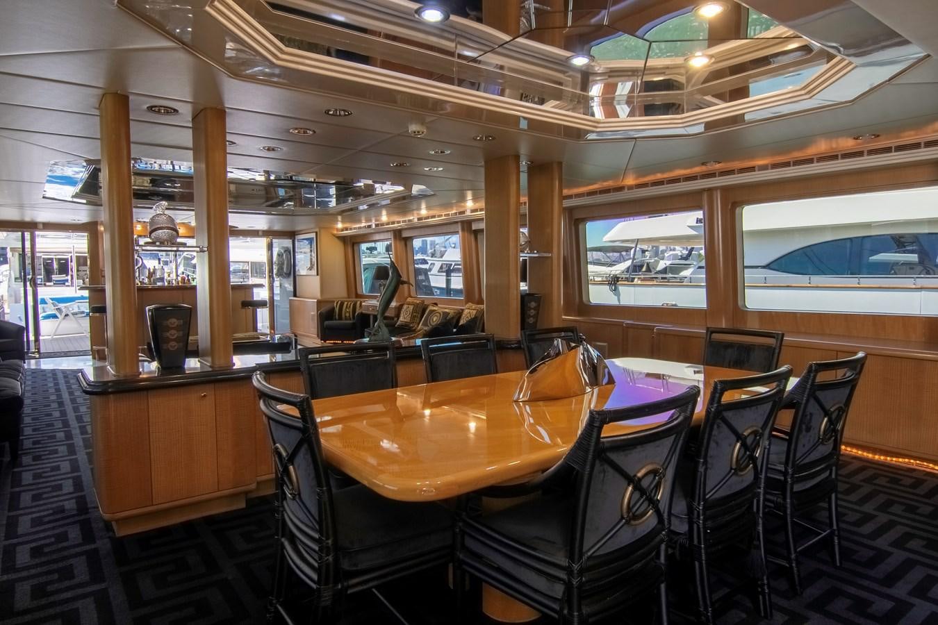 a restaurant with tables and chairs aboard LADY AUDREY Yacht for Sale
