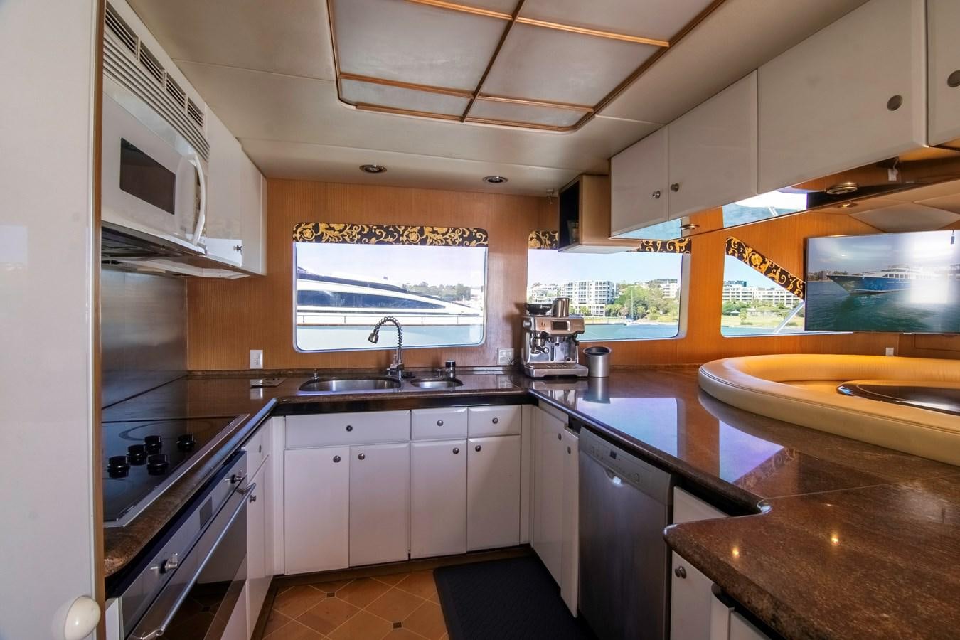 a kitchen with a stove and sink aboard LADY AUDREY Yacht for Sale