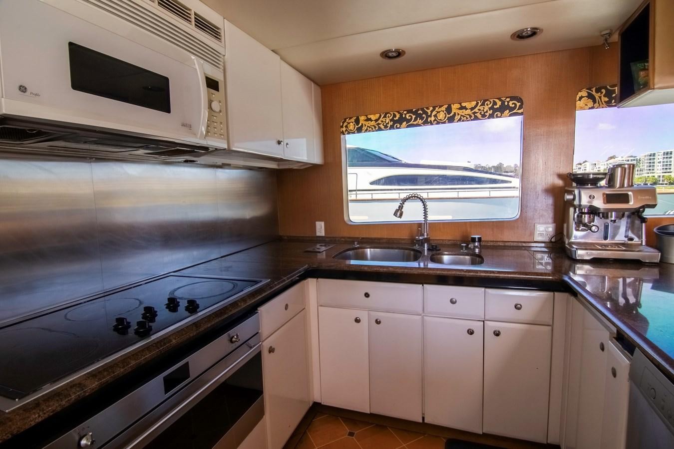 a kitchen with white cabinets aboard LADY AUDREY Yacht for Sale