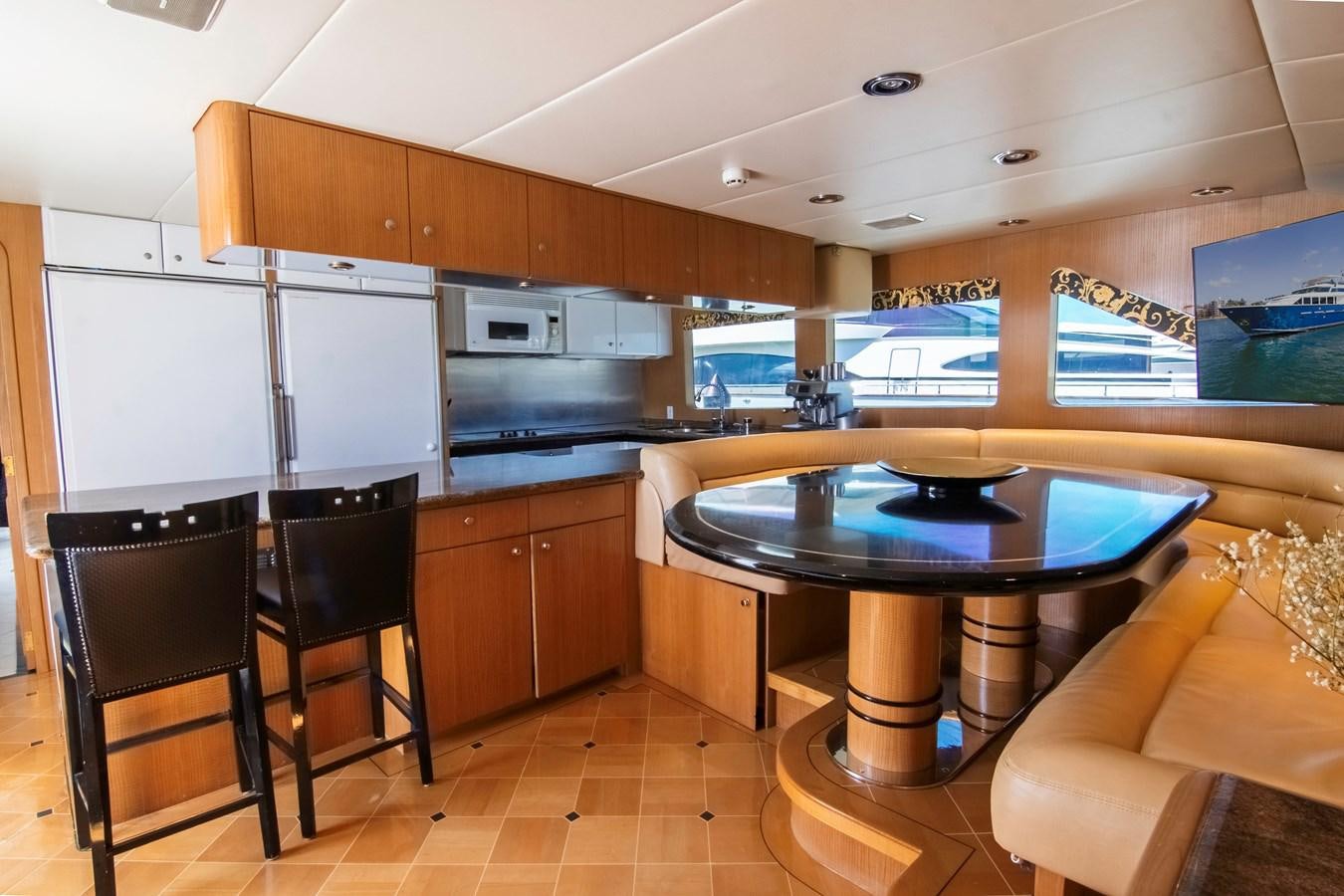 a kitchen with a table and chairs aboard LADY AUDREY Yacht for Sale