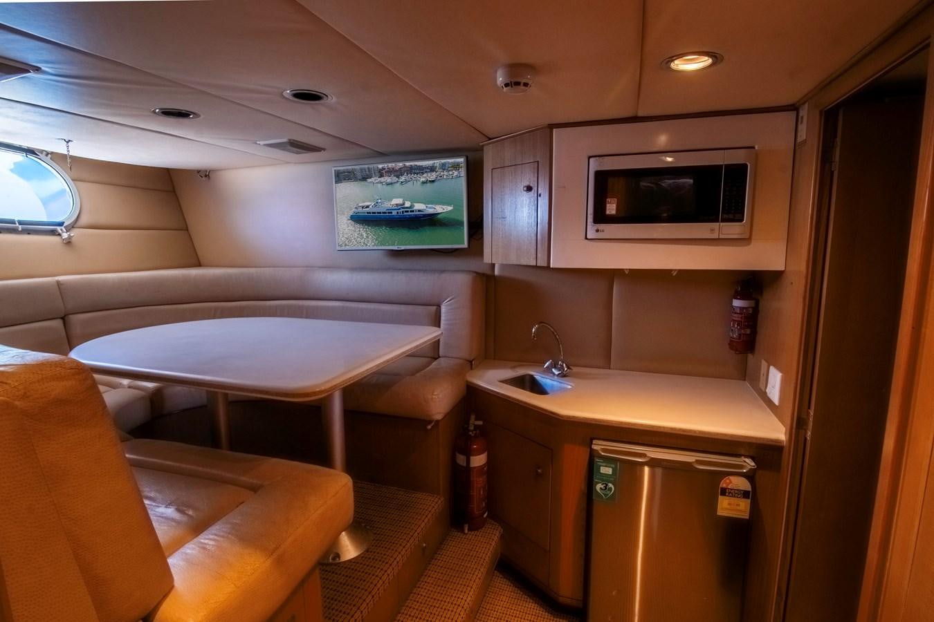 a room with a bed and a table aboard LADY AUDREY Yacht for Sale