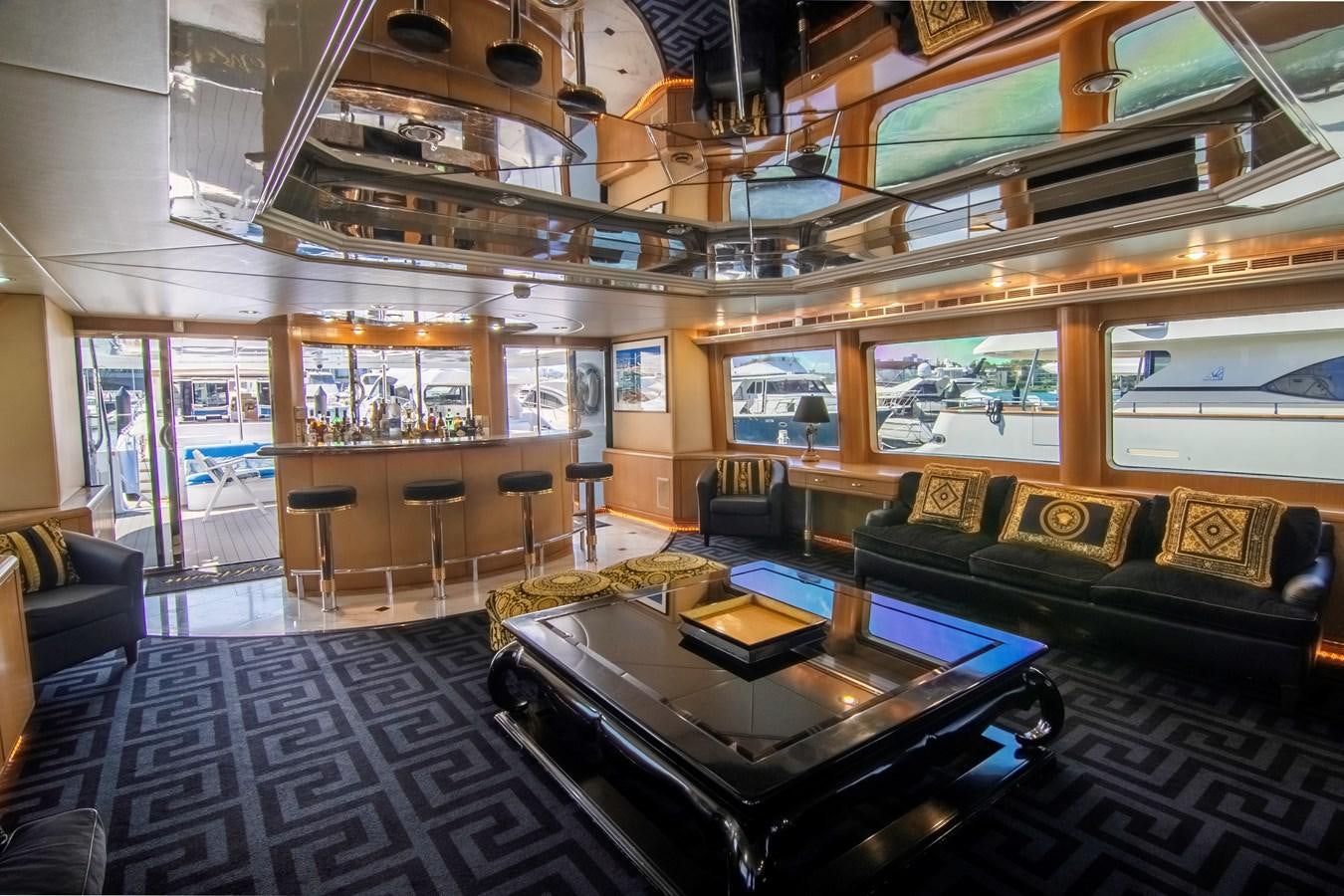 a living room with a large chandelier aboard LADY AUDREY Yacht for Sale