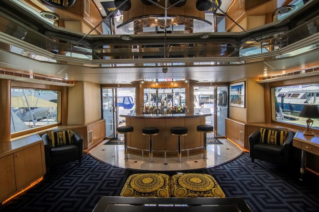 a large room with a large bar and a large window aboard LADY AUDREY Yacht for Sale