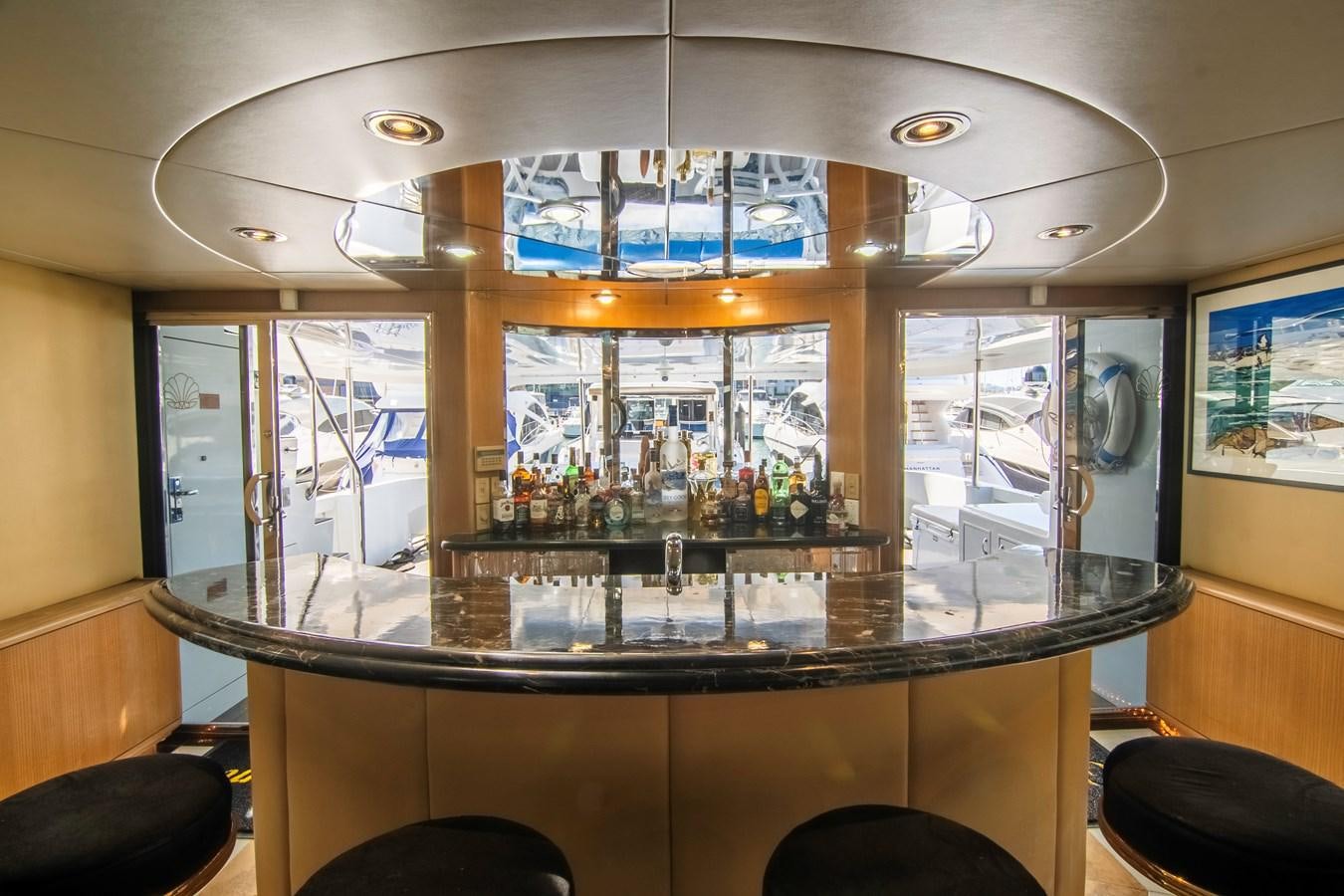 a bar with a chandelier aboard LADY AUDREY Yacht for Sale
