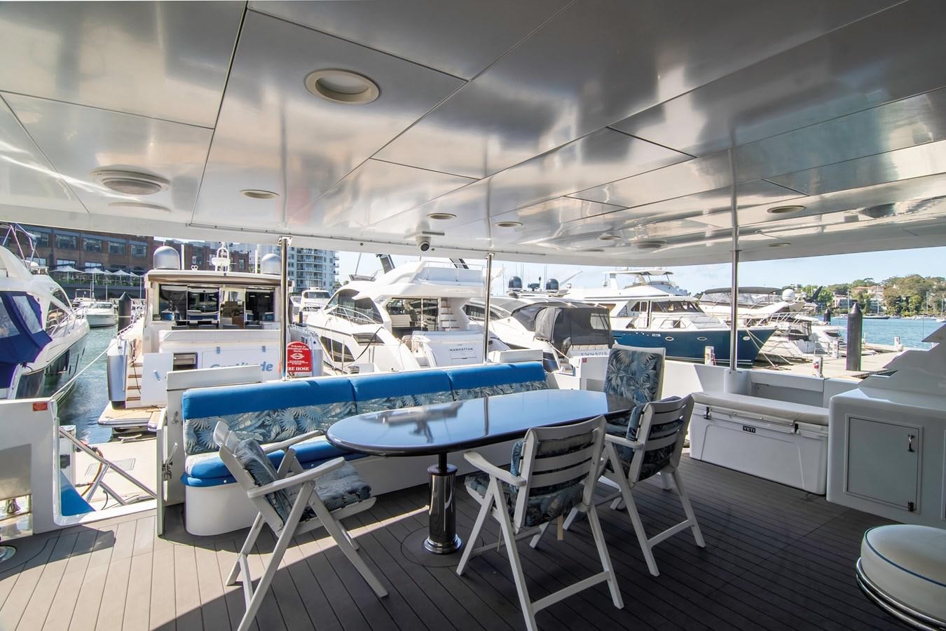 a large room with a table and chairs aboard LADY AUDREY Yacht for Sale