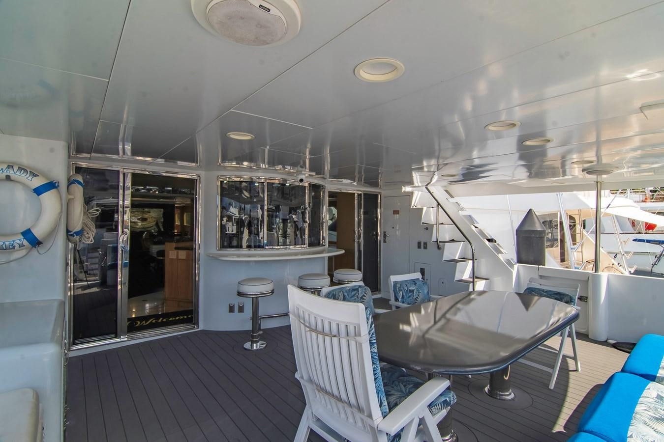 a room with a table chairs and a window aboard LADY AUDREY Yacht for Sale