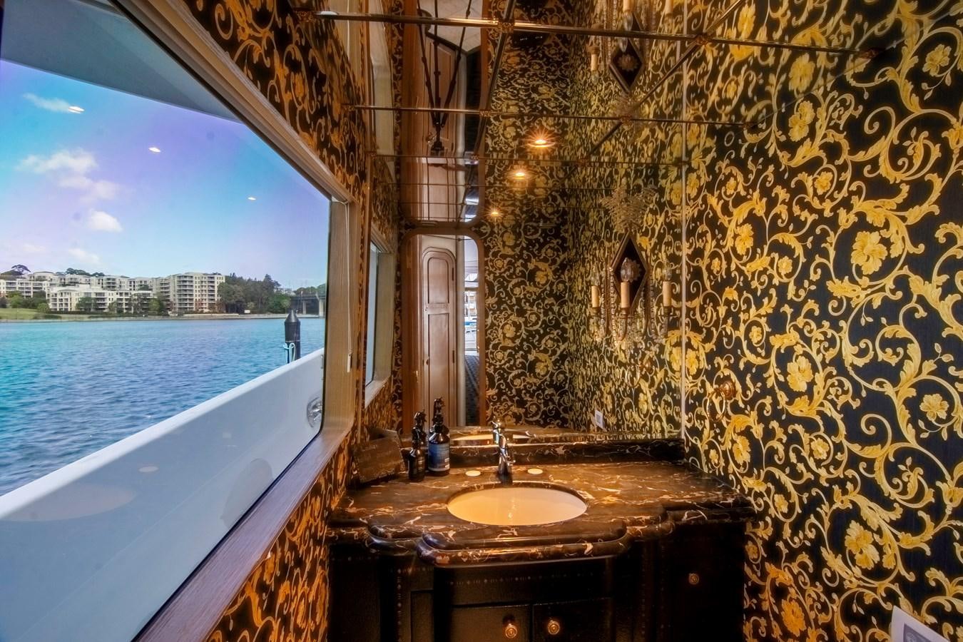 a bathroom with a sink and a bathtub aboard LADY AUDREY Yacht for Sale