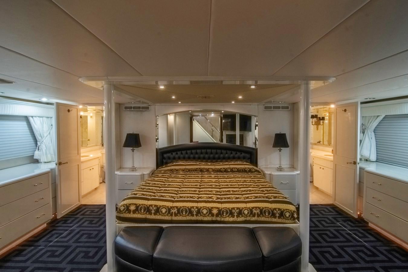 a bedroom with a bed and a desk aboard LADY AUDREY Yacht for Sale