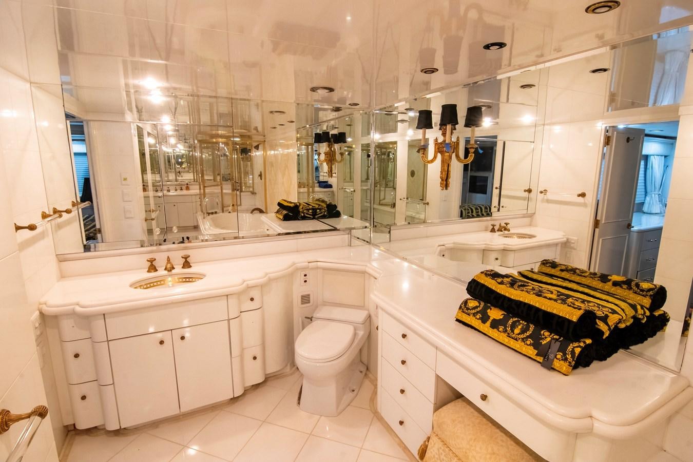 a bathroom with a tub sink and toilet aboard LADY AUDREY Yacht for Sale