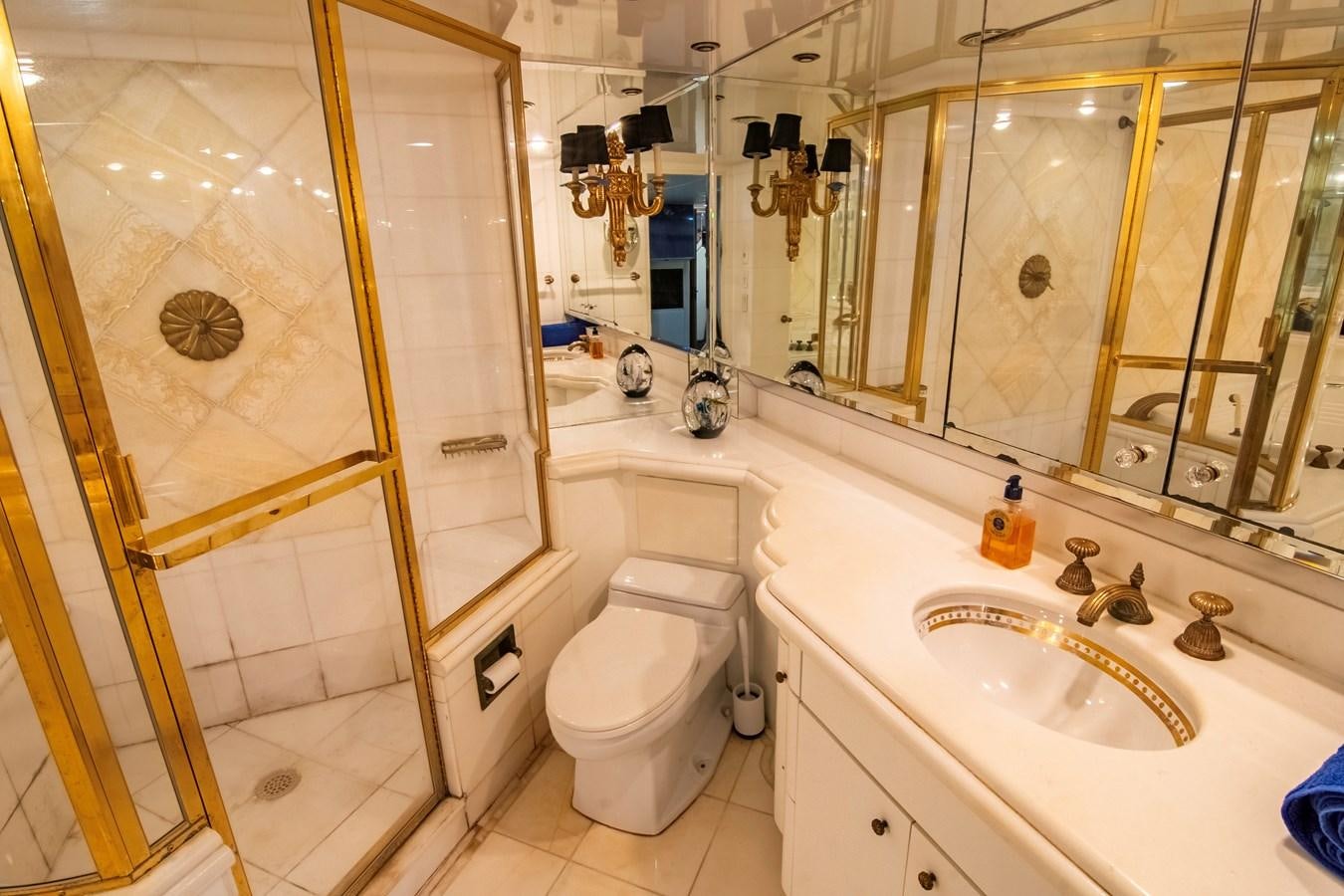 a bathroom with a glass shower door aboard LADY AUDREY Yacht for Sale