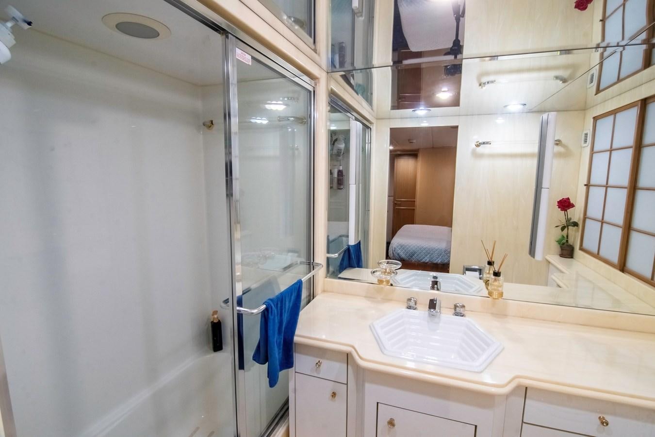 a bathroom with a sink and a mirror aboard LADY AUDREY Yacht for Sale