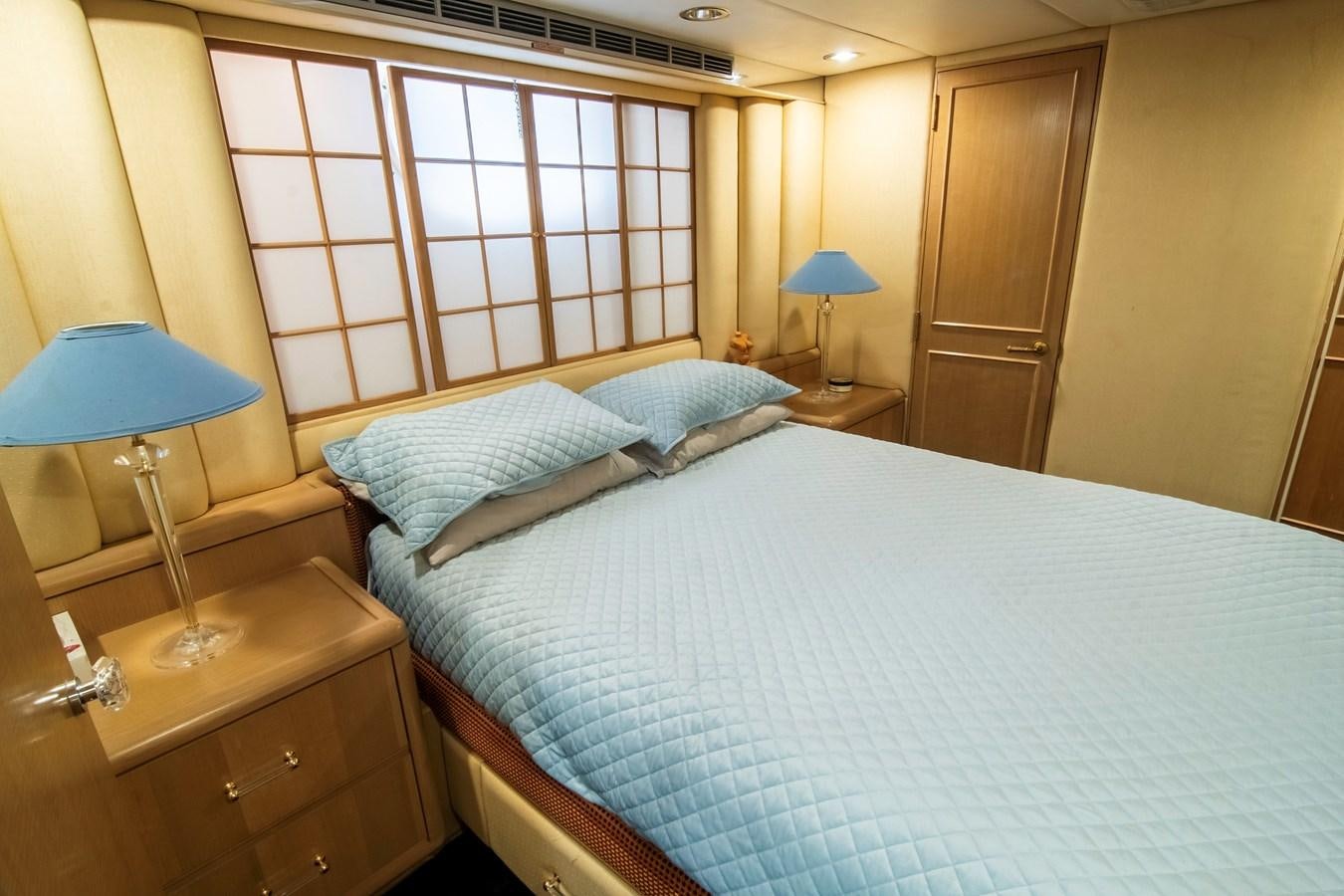 a bed with a white sheet aboard LADY AUDREY Yacht for Sale