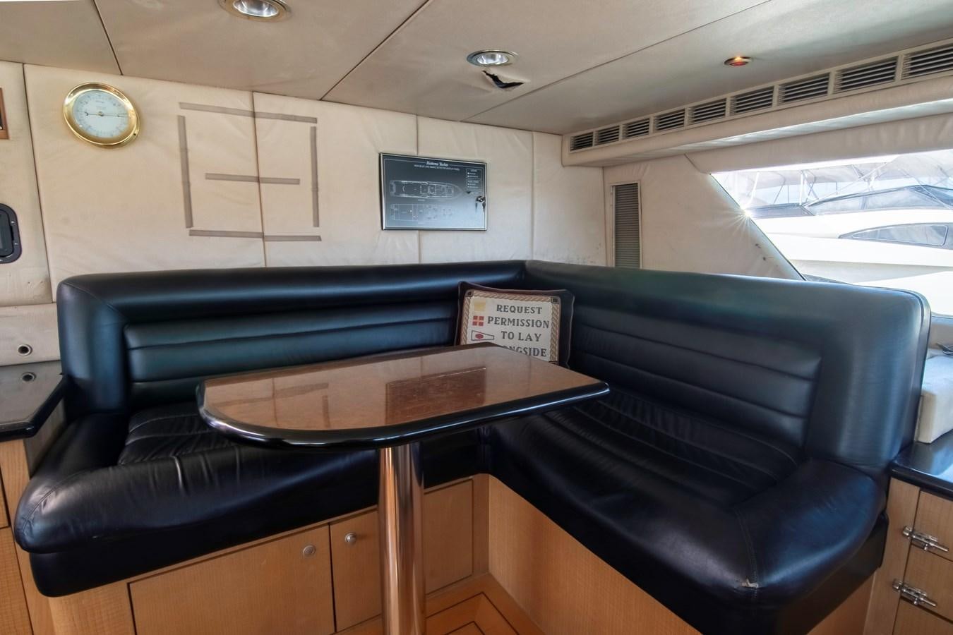 a room with a table and chairs aboard LADY AUDREY Yacht for Sale