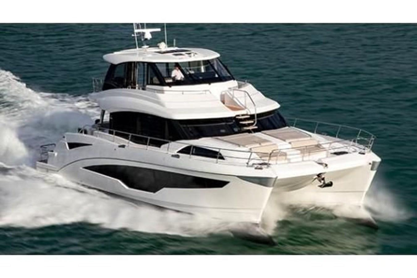 a white yacht on the water aboard 2021 AQUILA 70 LUXURY Yacht for Sale