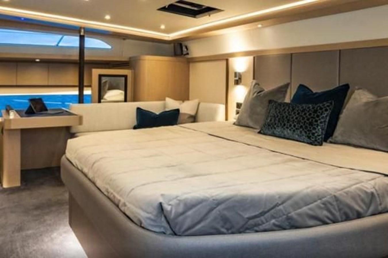 a large bed with pillows aboard 2021 AQUILA 70 LUXURY Yacht for Sale