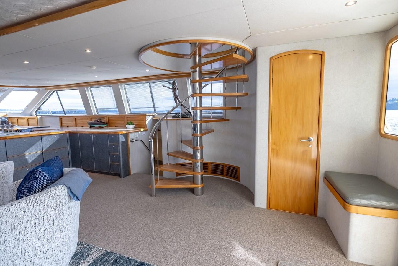 a room with a bed and a couch aboard WHITE LIGHTNING Yacht for Sale