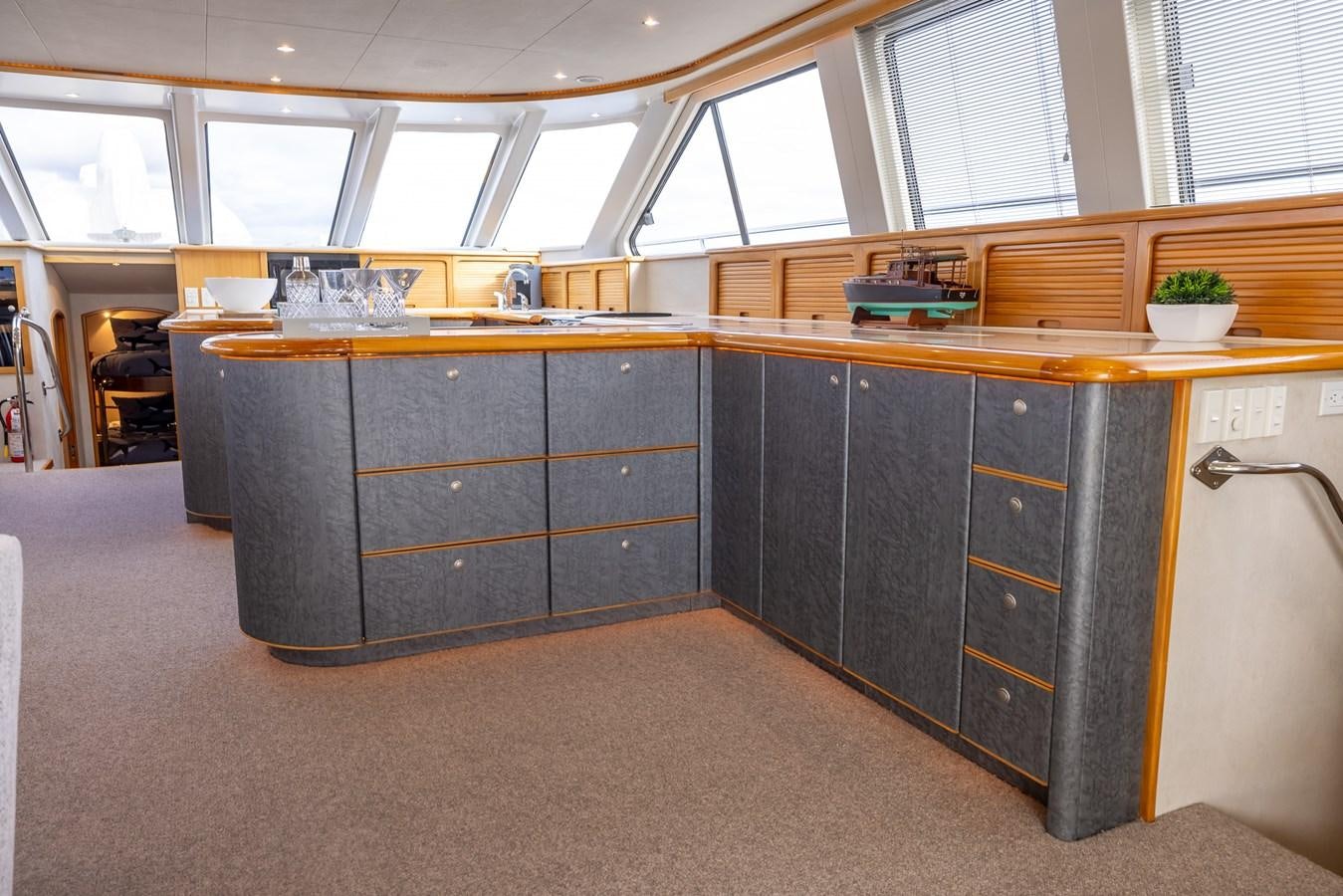a room with a desk and a window aboard WHITE LIGHTNING Yacht for Sale